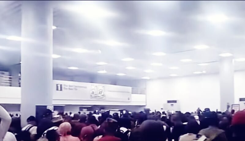 Passengers gathered inside an airport terminal during the aviation union disruption