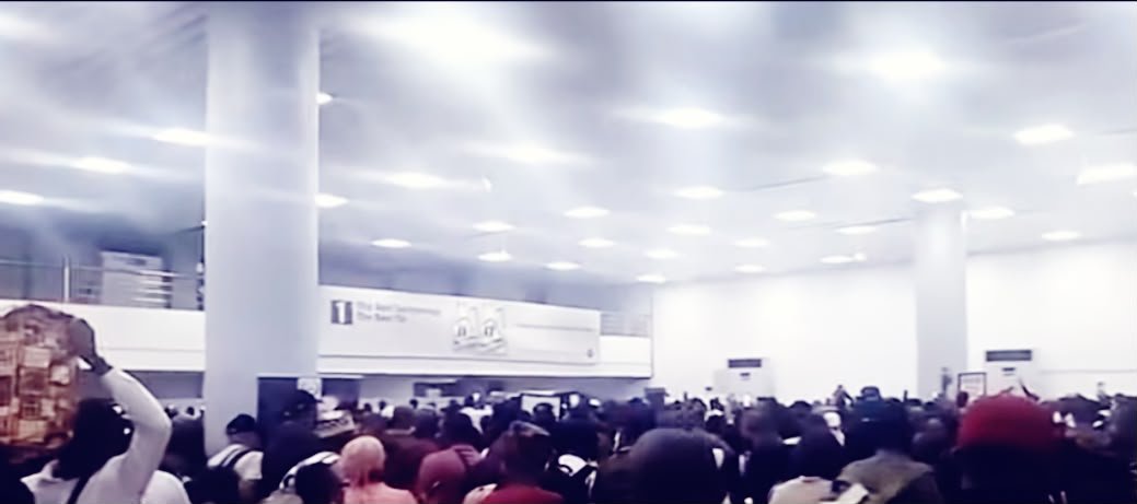 Passengers gathered inside an airport terminal during the aviation union disruption