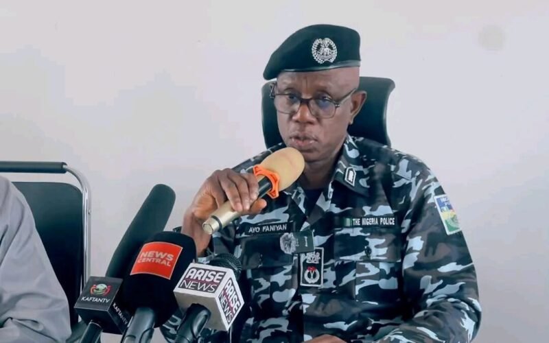 Plateau State police official at a press briefing, used as a contextual image for the child-rescue investigation