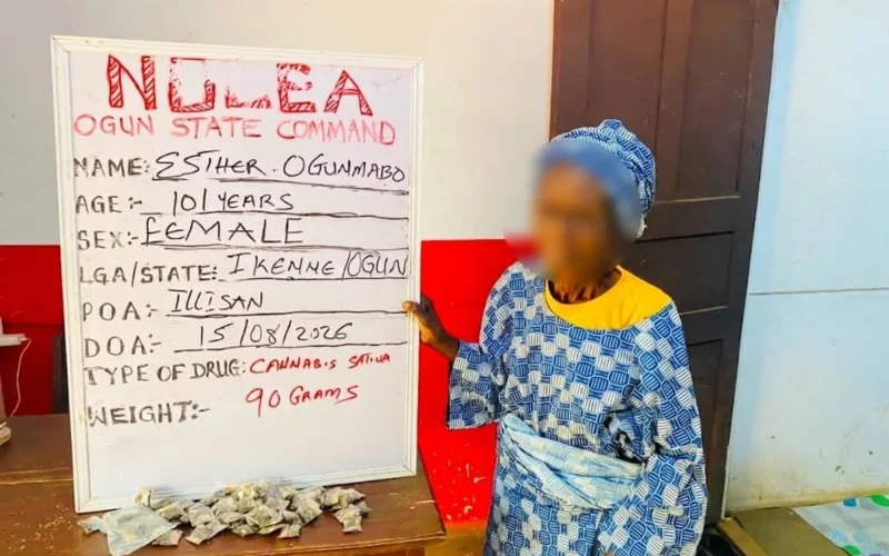 Esther Ogunmabo beside an NDLEA Ogun State Command board after her arrest over cannabis