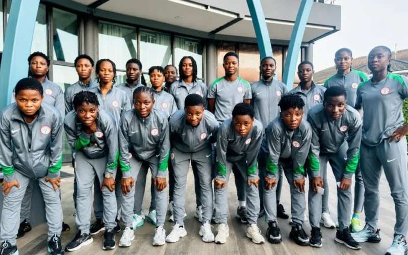 Nigeria Falconets players in team tracksuits.