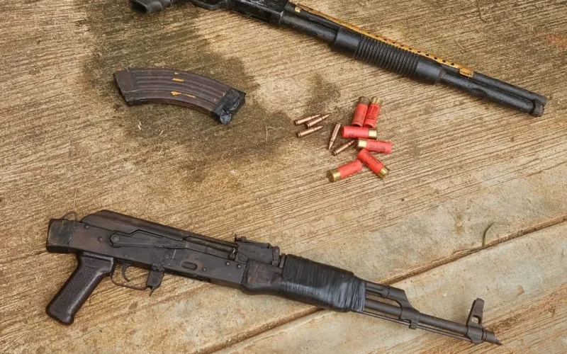 Recovered AK-47 rifle, pump-action gun, magazine and ammunition displayed by Anambra police