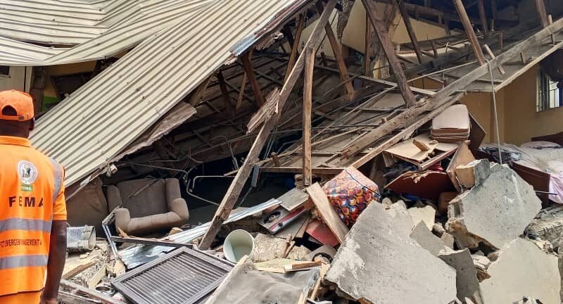 Emergency officials at the scene of the collapsed building in Kubwa, Abuja.