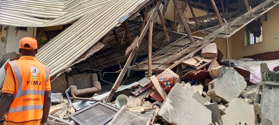 Emergency officials at the scene of the collapsed building in Kubwa, Abuja.