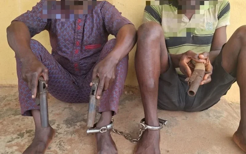 Two arrested robbery suspects with recovered locally made pistols in Ogun State
