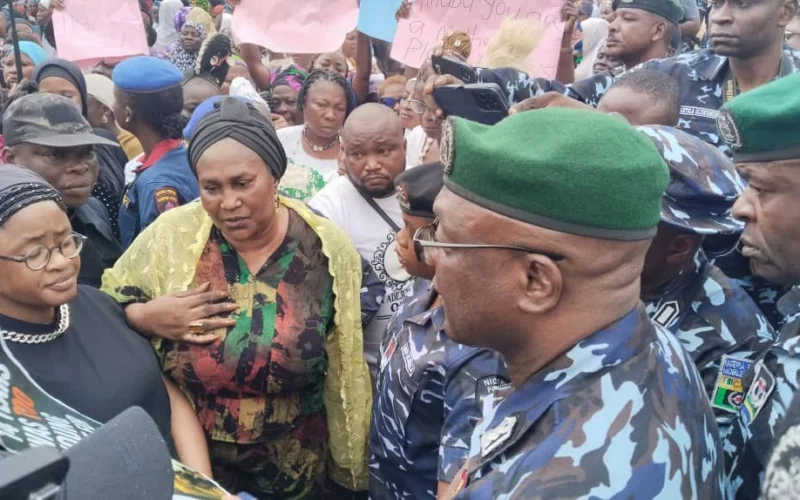 Osun First Lady Titilola Adeleke with women protesters and police officers in Osogbo ahead of the governorship election