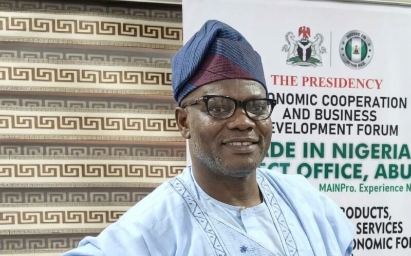 George Buchi Nwabueze standing in front of a Made in Nigeria office backdrop