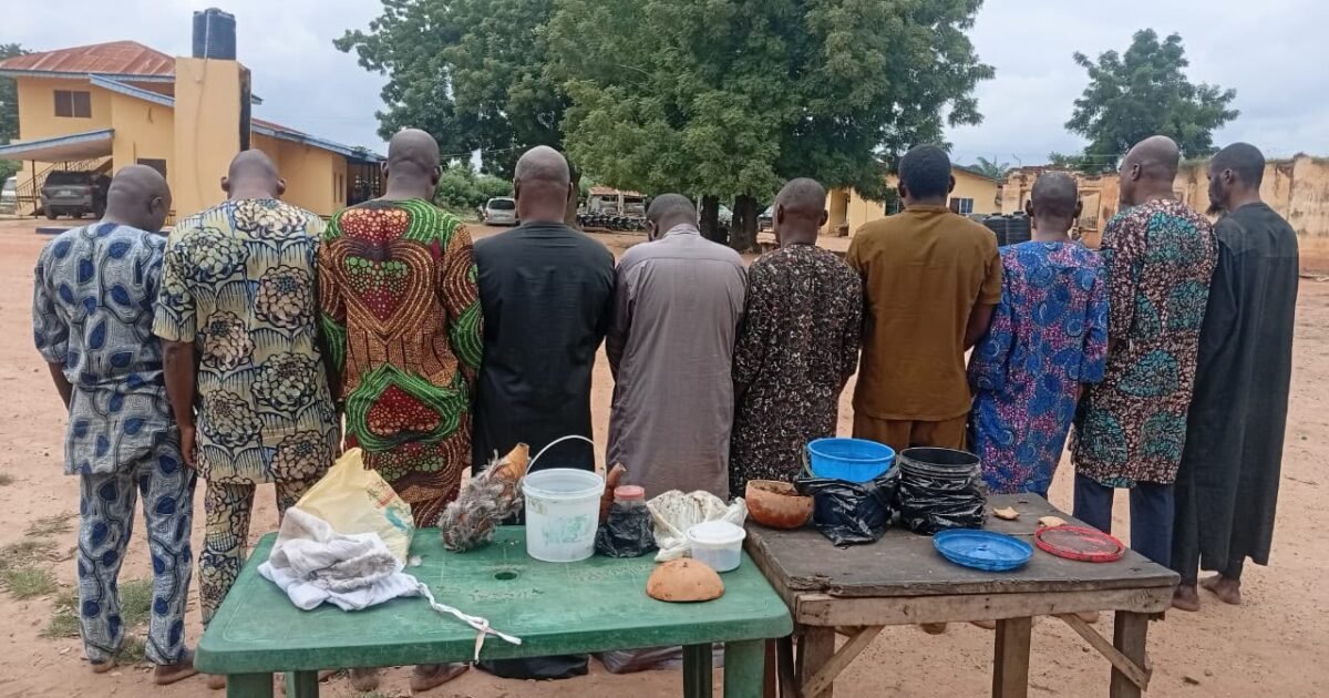 Suspects shown from behind with items displayed after Oyo police announced arrests linked to alleged human-parts trading