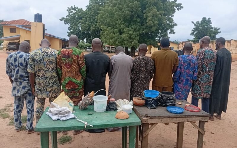 Suspects shown from behind with items displayed after Oyo police announced arrests linked to alleged human-parts trading