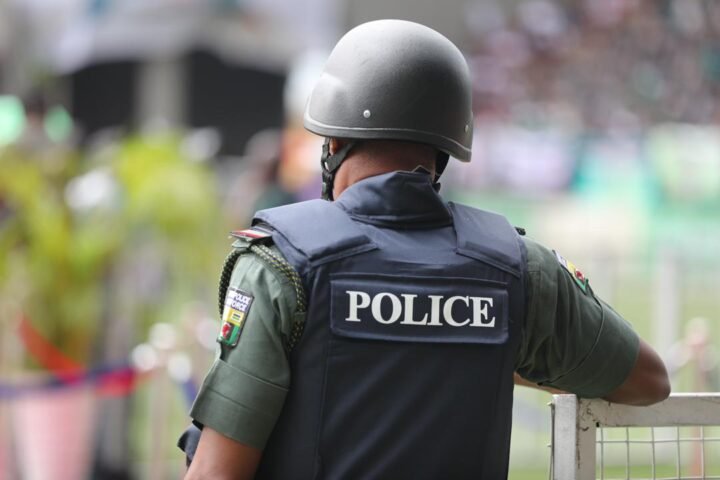 A Nigerian police officer photographed from behind, used as a contextual image for an Ondo police arrest story.