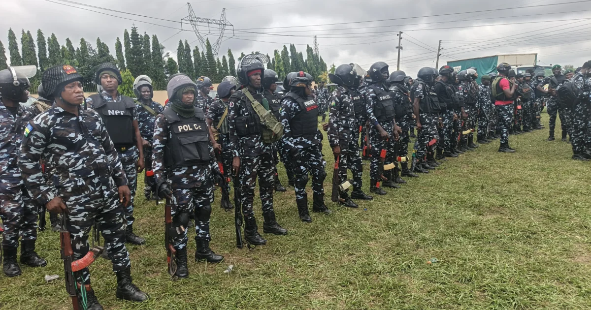 Source-origin Punch photo of police operatives assembled for election security, used for the Osun deployment story.