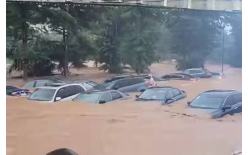 Vehicles submerged by floodwater in Abuja.
