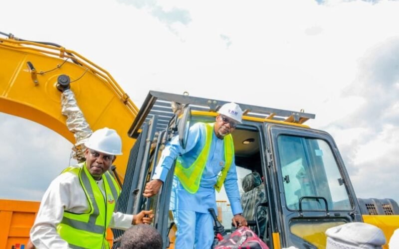 Officials beside construction machinery at the Ibadan-Ijebu-Ode road reconstruction flag-off