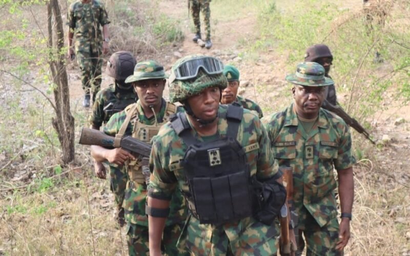 Nigerian soldiers moving through bush terrain during a Zamfara security operation.