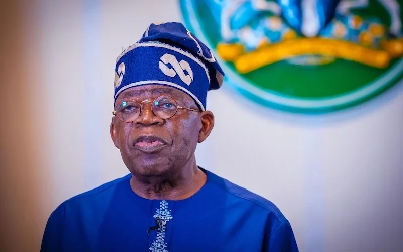 President Bola Tinubu in a blue traditional outfit during an official engagement