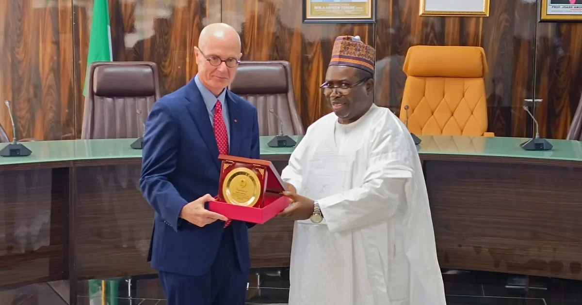 INEC chairman Joash Amupitan receives Canadian diplomat David Sproule during a visit to the commission.