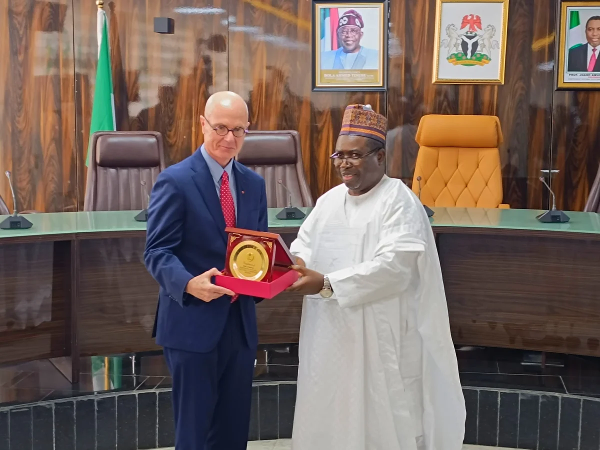 INEC Chairman Professor Joash Amupitan receiving a visitor at the commission’s headquarters.
