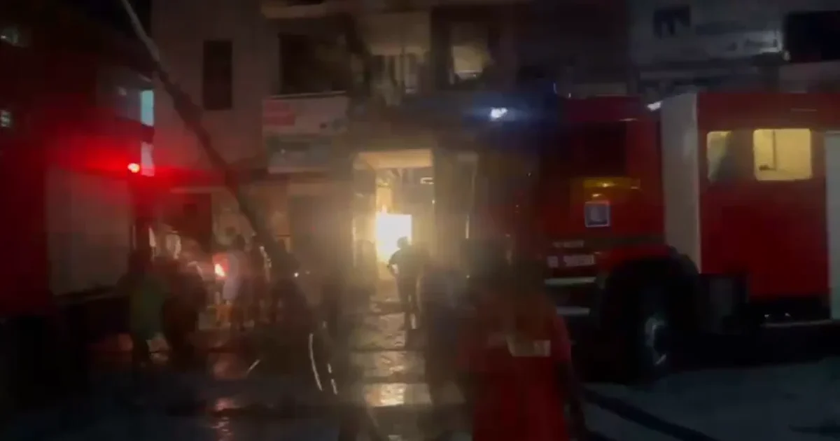 Firefighters and emergency vehicles at Eda Plaza in Jabi Abuja during a building materials market fire