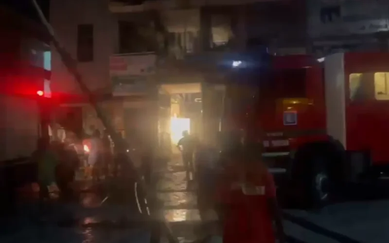 Firefighters and emergency vehicles at Eda Plaza in Jabi Abuja during a building materials market fire