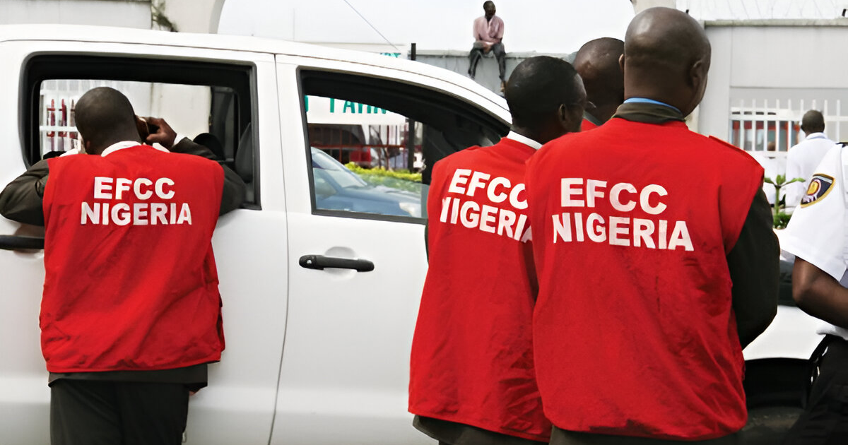 EFCC operatives standing near a vehicle during an enforcement operation