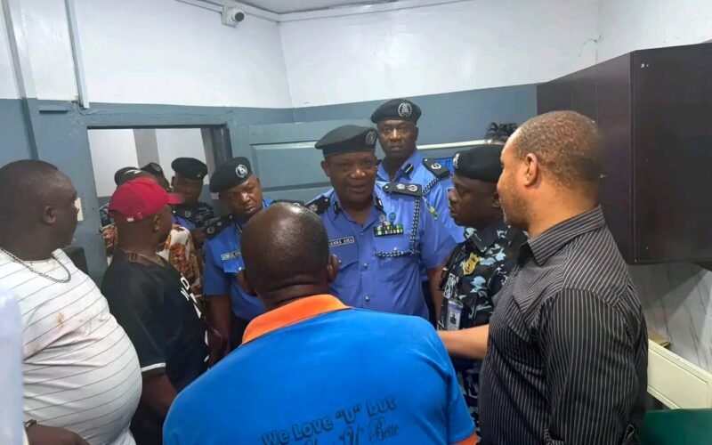 Anambra police commissioner Nnanna Ama and officers visit people injured after the Onitsha Head Bridge incident