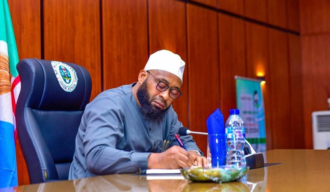 Niger State Governor Umaru Bago seated at a desk during an official engagement