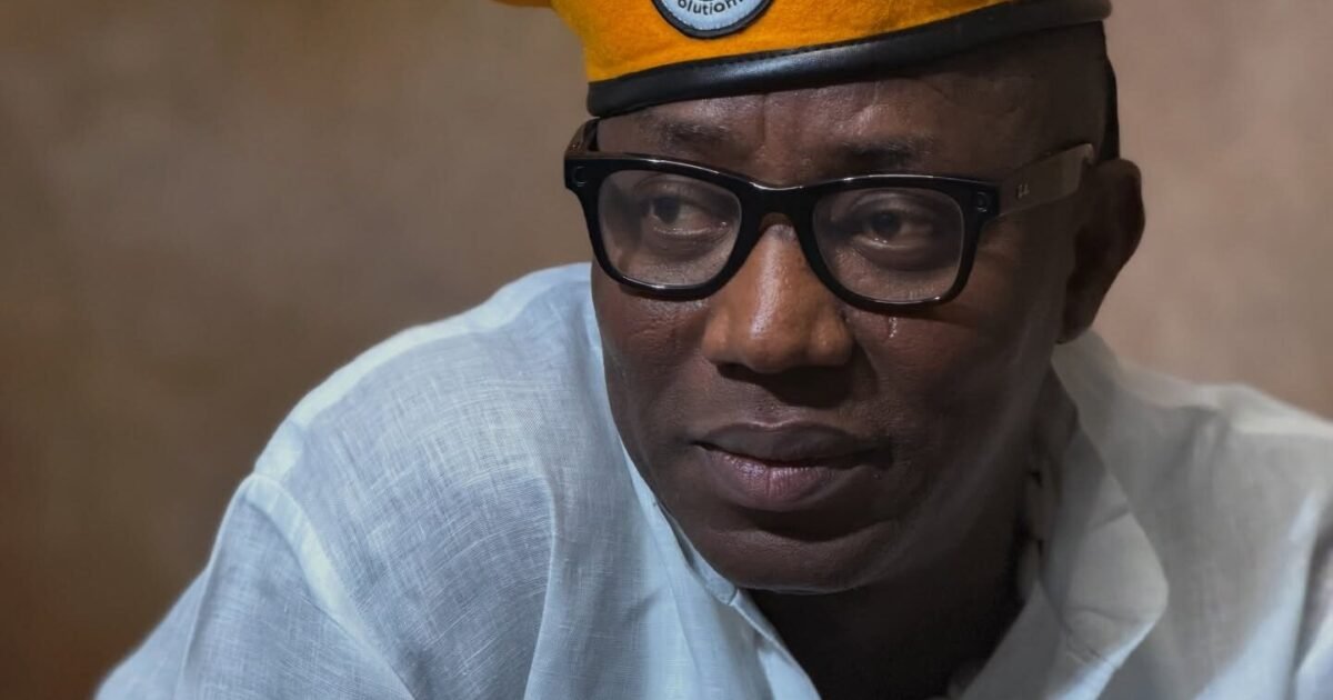 Omoyele Sowore wearing glasses and a yellow beret.