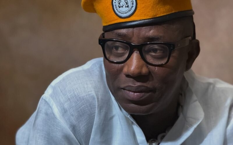 Omoyele Sowore wearing glasses and a yellow beret.