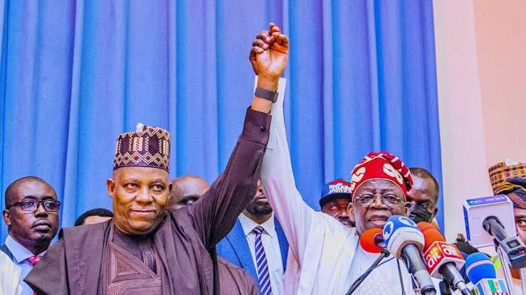 President Bola Tinubu with an APC official at a party event