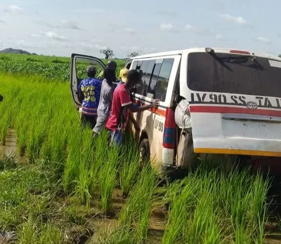 Rescued passengers beside a vehicle after the Zamfara abduction response.