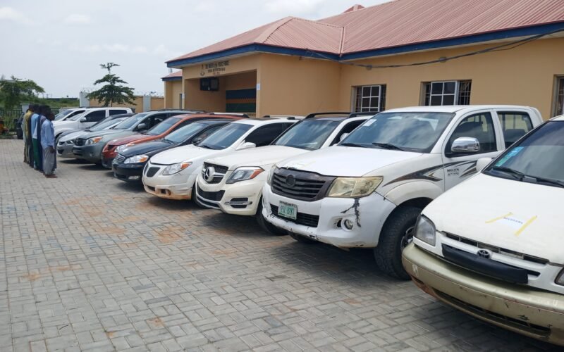 Recovered vehicles lined up at a Kano police facility