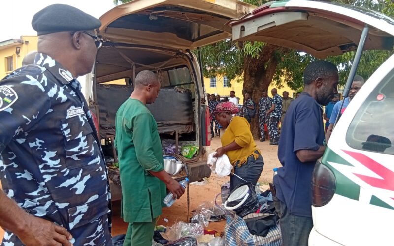 Police and rescued passengers beside a vehicle after a Benue kidnap rescue