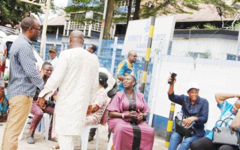 Parents at the entrance of King's College Lagos during the concession dispute