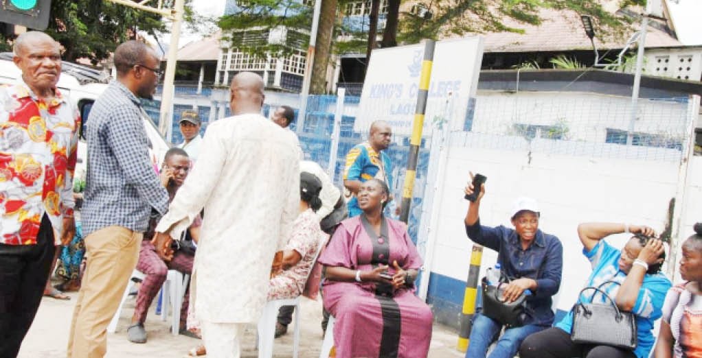 Parents at the entrance of King's College Lagos during the concession dispute