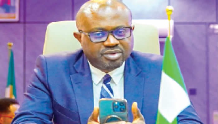 Interior Minister Olubunmi Tunji-Ojo seated at a meeting table