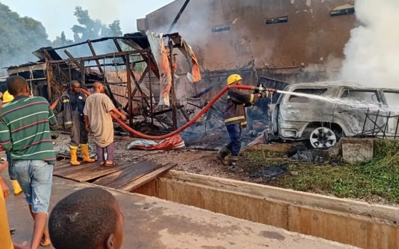 Firefighters at the scene of a burnt gas-store area and vehicle in Kubwa Abuja