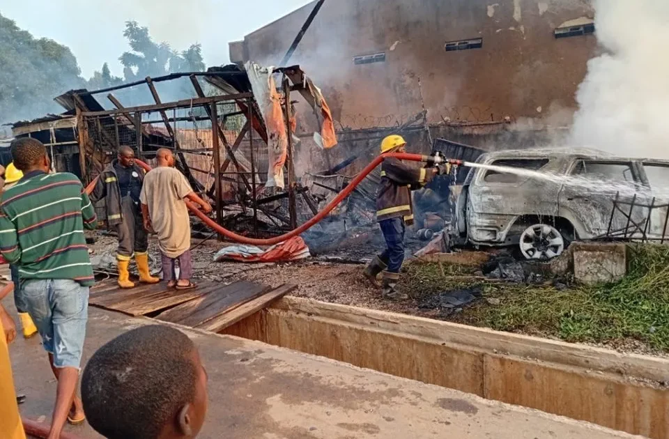 Firefighters at the scene of a burnt gas-store area and vehicle in Kubwa Abuja