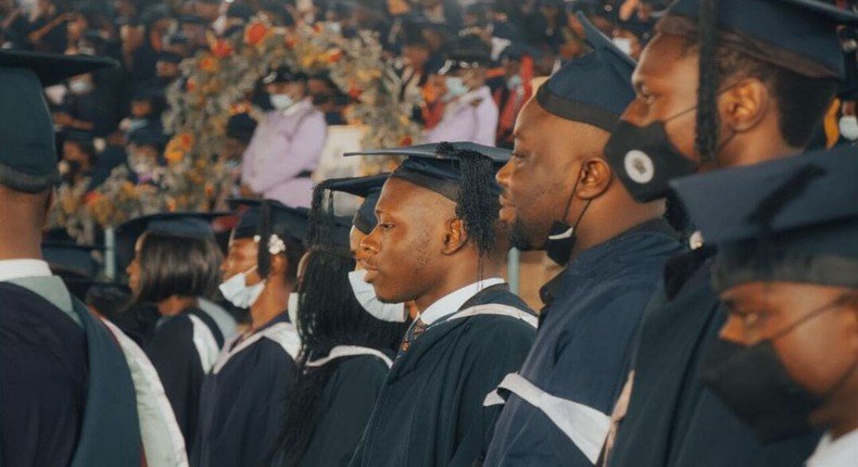 African students in academic regalia at a graduation ceremony