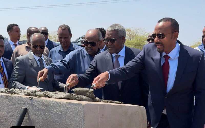 Officials ceremonially laying mortar at the Damarjog–Dewele pipeline groundbreaking in Djibouti