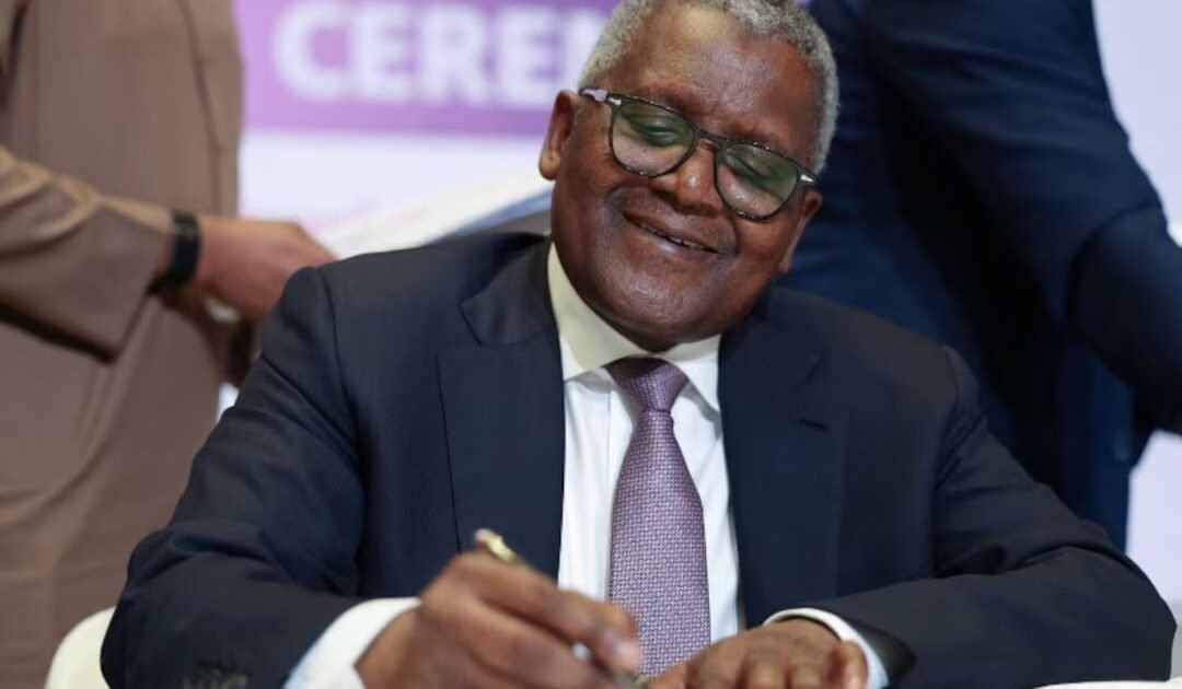 Aliko Dangote signing documents at the Dangote Refinery IPO signing ceremony in Lagos
