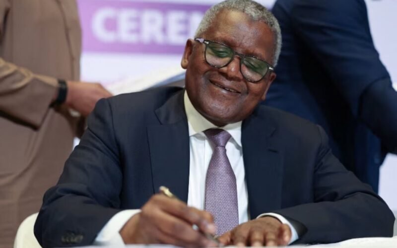Aliko Dangote signing documents at the Dangote Refinery IPO signing ceremony in Lagos