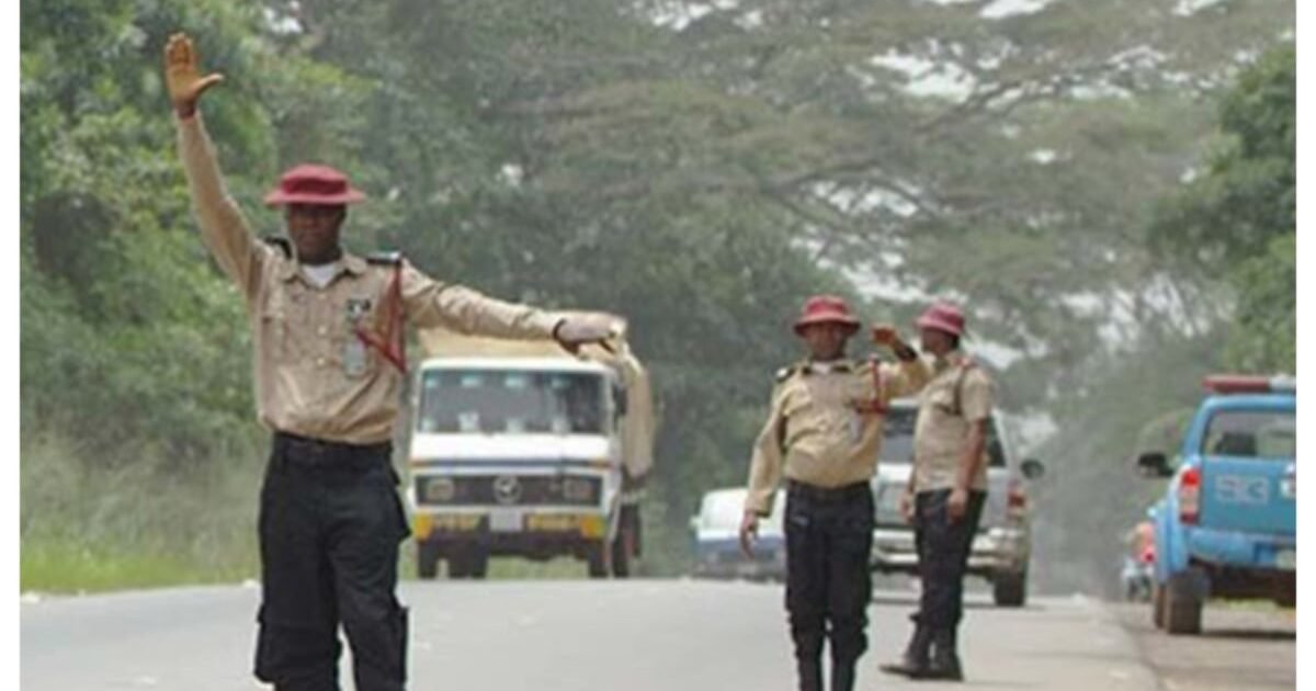FRSC officials controlling traffic on a road.