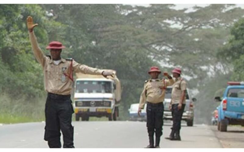 FRSC officials controlling traffic on a road.