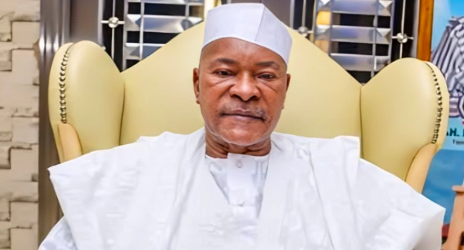 Former Kogi governor Ibrahim Idris seated in white traditional attire