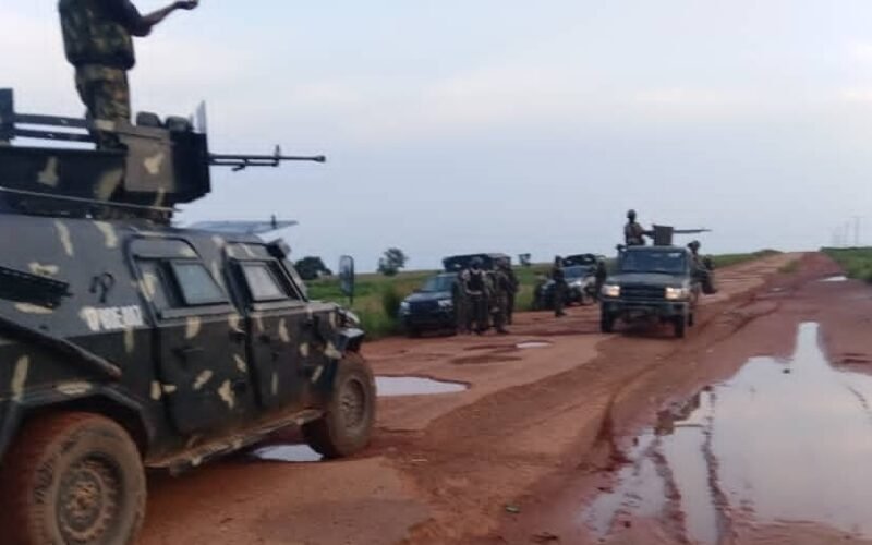 Troops and patrol vehicles on a rural road in Katsina State