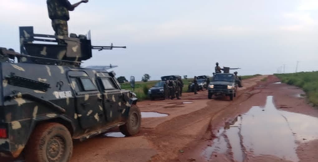 Troops and patrol vehicles on a rural road in Katsina State