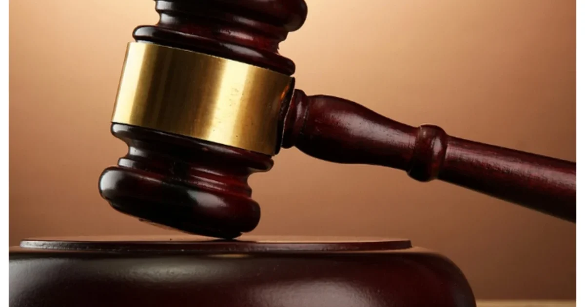 Court gavel on a courtroom bench