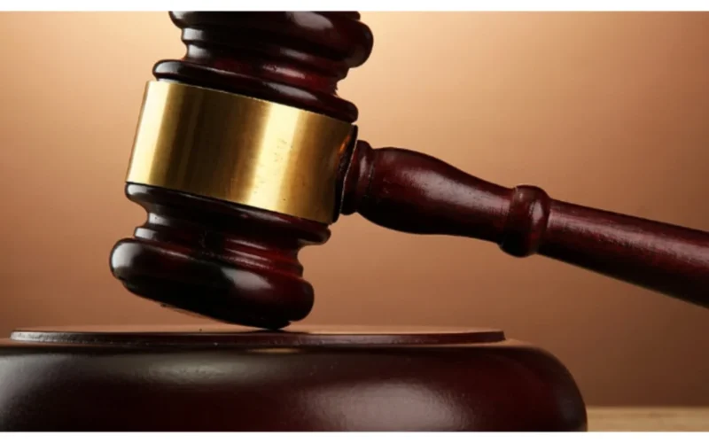 Court gavel on a courtroom bench
