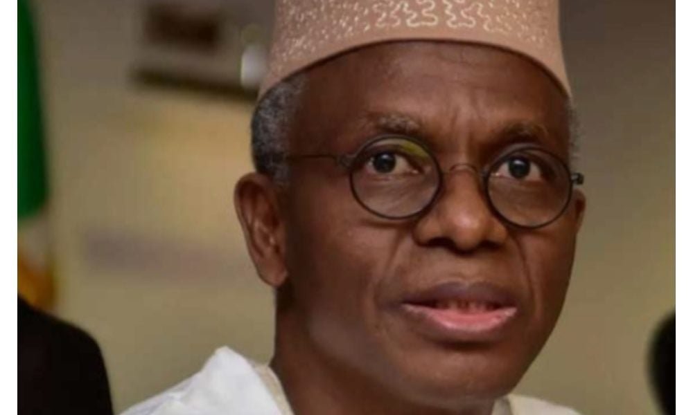 Nasir El-Rufai wearing glasses and a traditional cap.