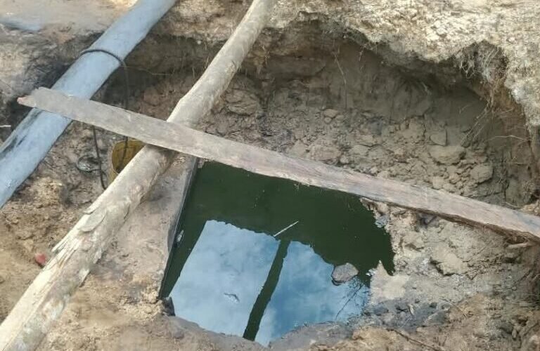 Dugout reservoir containing suspected stolen crude oil found during a Nigerian Navy operation in Delta State.